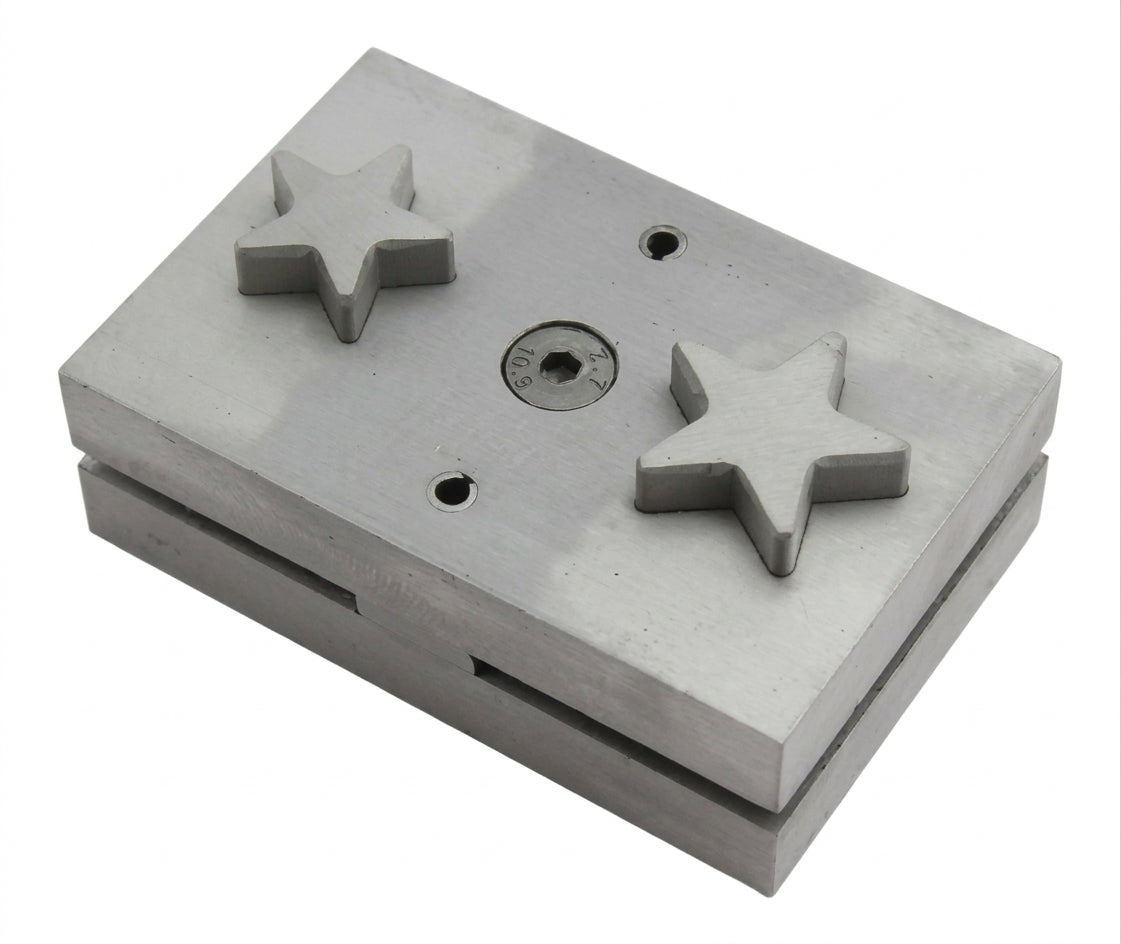 Close-up of the star-shaped punch die of the steel disc cutter, showing its clean edges