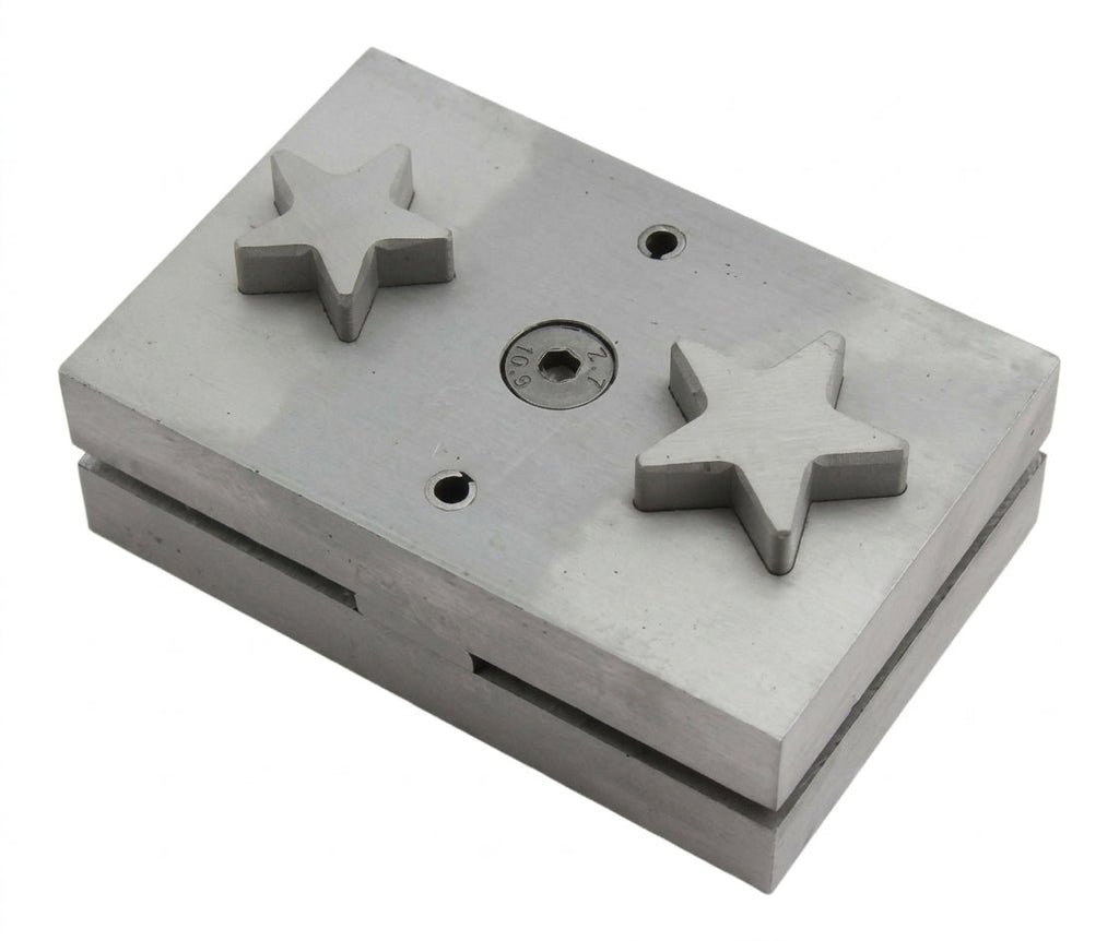 Close-up of the large star-shaped steel punch tool's cutting edge, ready for metal sheet work.