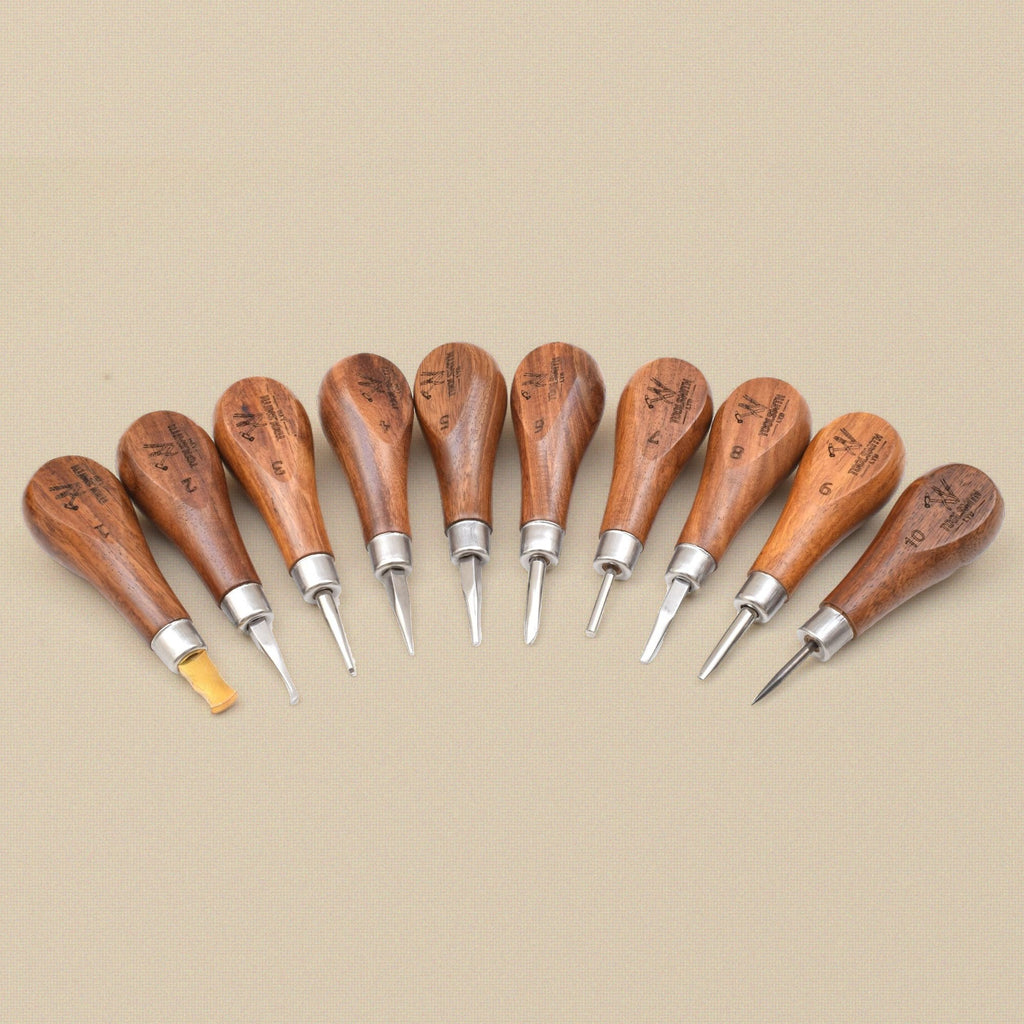 Stone setting tools arranged in a fan, handles to the front