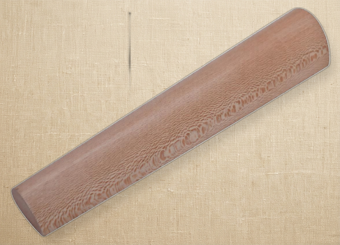 Close-up of the teardrop-shaped end of the wooden bracelet shaping mandrel