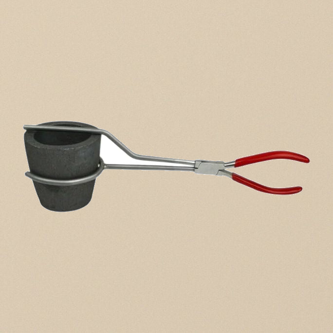 Metal crucible tongs with red PVC handles gripping a graphite crucible, side view