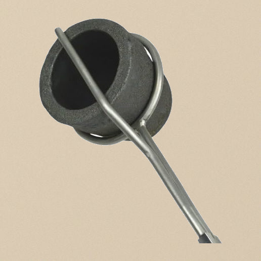 Close-up of the crucible tongs holder ring securing a graphite crucible