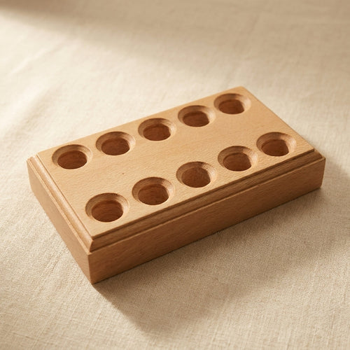 Close-up of the 10-slot wooden stand, showing the organised arrangement for jewellery pliers.