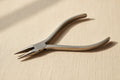 Stainless steel slim line chain nose pliers, 120mm, with square handles for jewellery making.