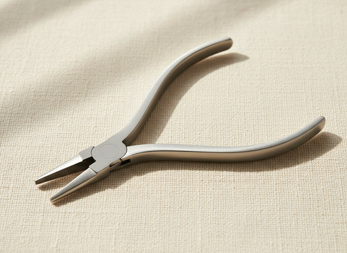 Close-up of slim stainless steel flat nose pliers jaws for jewellery work