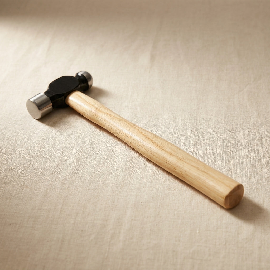 Close-up of the ball peen end of the 2oz forming hammer, showing its polished surface.