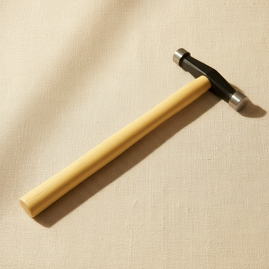 Silversmith's planishing hammer with domed and flat faces, wooden handle, 12 inches long