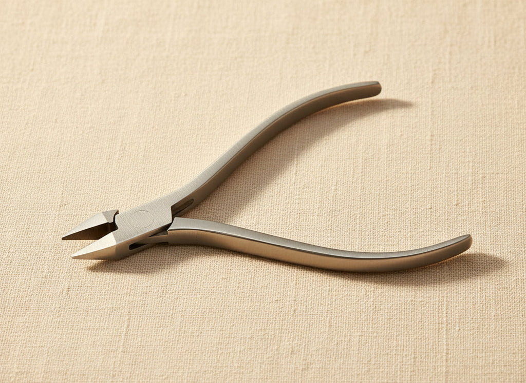 Close-up of the slim stainless steel jaws of the jewellery pliers.