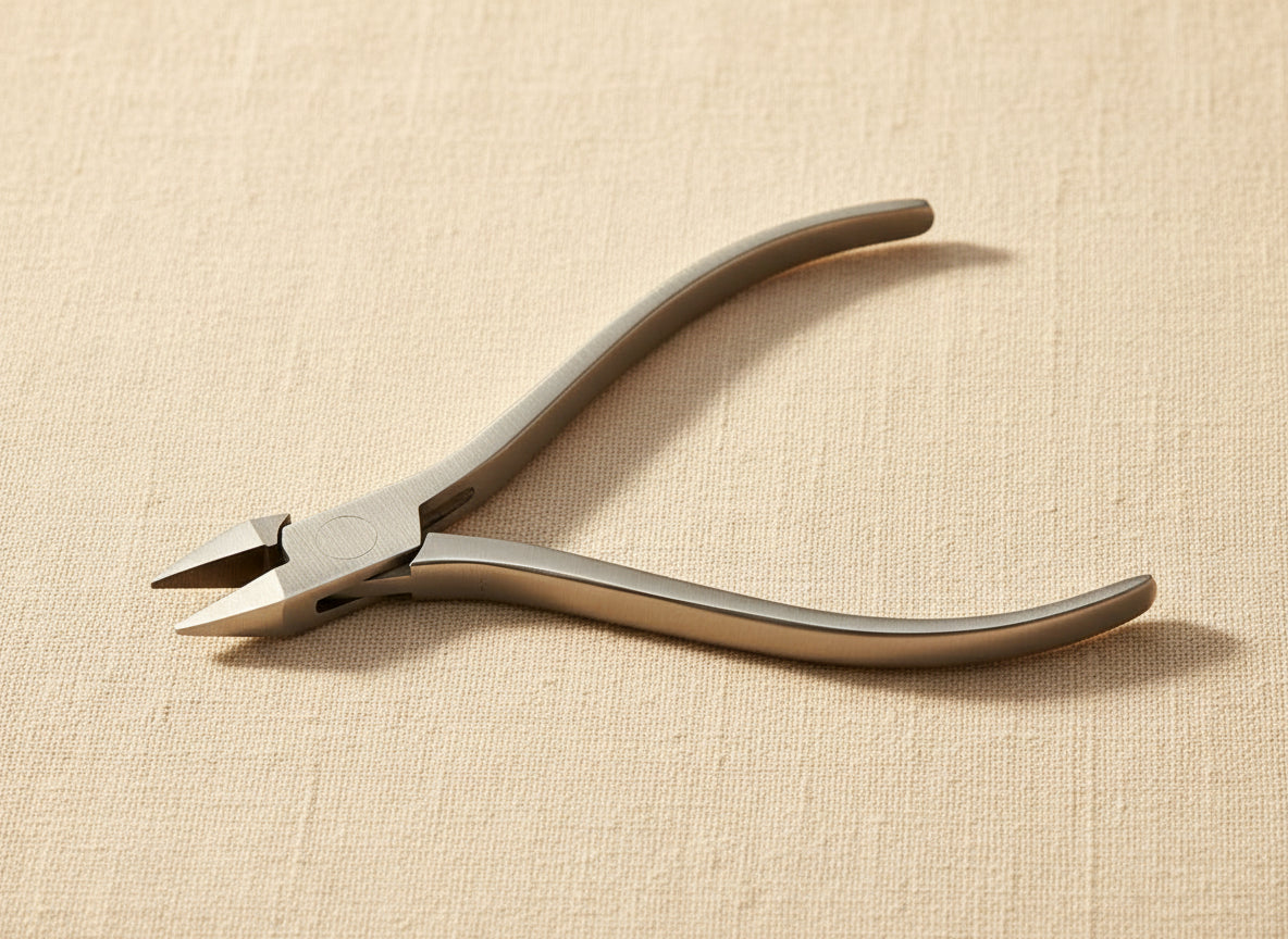 Close-up of the slim stainless steel jaws of the jewellery pliers.