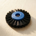 Two stiff black bristle lathe brushes with blue plastic centres, 80mm diameter, for jewellery cleaning and polishing