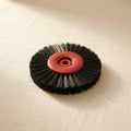 Two red plastic lathe brushes, 72mm diameter, with stiff black bristles for jewellery making