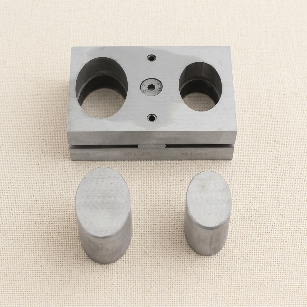 Steel disc cutter for silversmiths, creating 2-punch oval metal shapes.