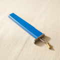 Blue professional jewellery knotting tool for consistent knots with beads.