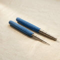 Stainless steel wire wrapping mandrels with blue foam grips for jewellery making.