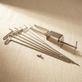 Coiling Gizmo with five spindles for making wire coils and beads, made from stainless steel.