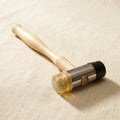 Double-ended jeweller's mallet with plastic and rubber heads for forming metal
