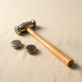 Dual-sided silversmithing hammer with stripe and weave texturing faces, ideal for jewellery crafts