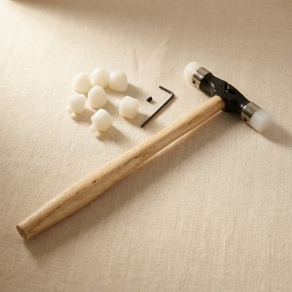 Jewellery planishing hammer with nylon head, interchangeable tips and wooden handle for silversmiths
