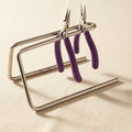 Sturdy metal rack for organising 6-inch jewellery pliers and beading tools.
