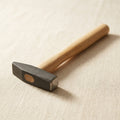 Octagonal and rectangular faced locksmith's hammer with wooden handle for silversmithing and jewellery making