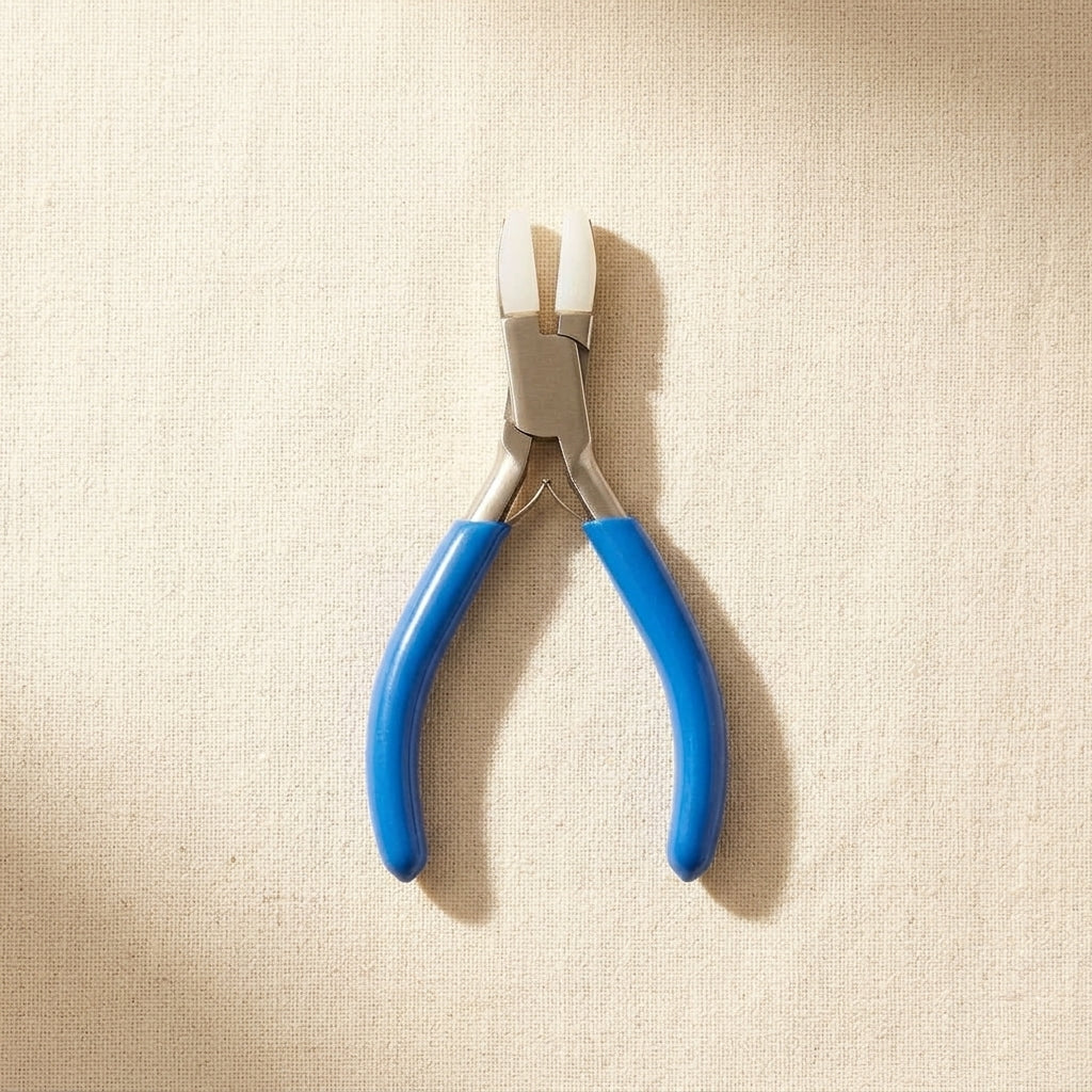 Mini stainless steel flat nose pliers with double nylon jaws for jewellery making.