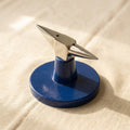 Miniature horn anvil with broad base for jewellery making and metal forming.