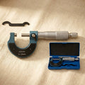 Outside micrometer 0-25mm, metric measurement tool with 0.01mm graduations, metal construction.