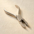 Polished stainless steel loop closing pliers for jewellery making, 5-inch length, parallel action.