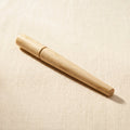 Professional 12-inch wooden ring shaping stick with a tapered end for forming and enlarging rings.