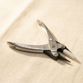 Professional parallel action jewellery pliers with silver metal body and nylon jaws