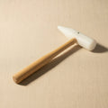 Jewellery forming mallet with round and cone Teflon heads and wooden handle for shaping metal.