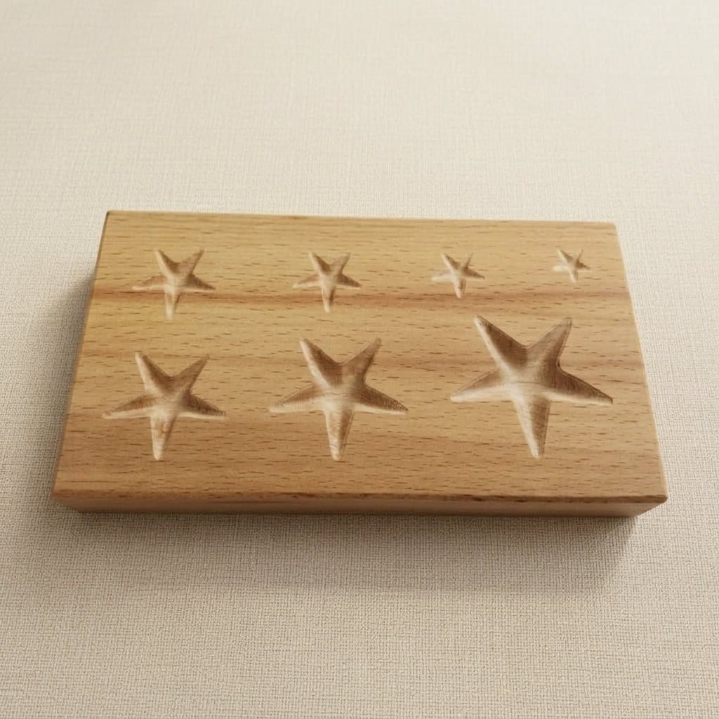 Wooden dapping block for shaping jewellery metal with seven star-shaped cavities