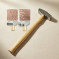 Jewellery texturing hammer with star and crosshatch pattern heads and wooden handle