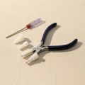 Wire wrapping pliers with interchangeable nylon jaws for jewellery making, featuring parallel action and a stainless-steel finish.
