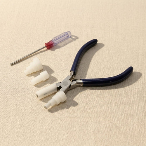 Wire wrapping pliers with interchangeable nylon jaws for jewellery making, featuring parallel action and a stainless-steel finish.