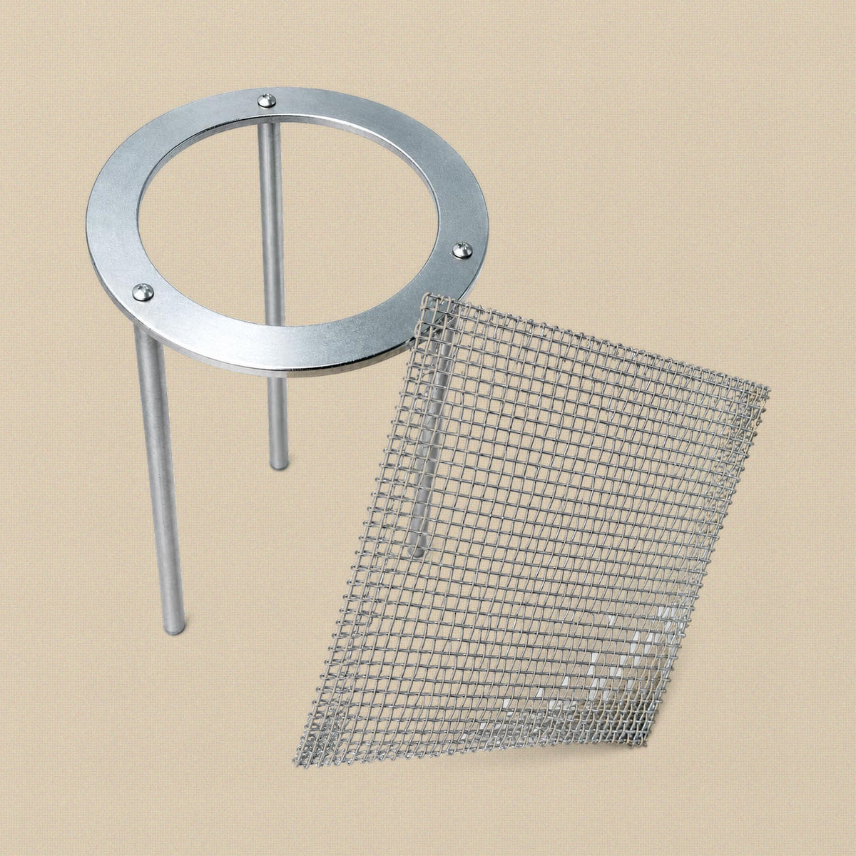 Soldering tripod stand with the 6 inch wire mesh screen leaning against it