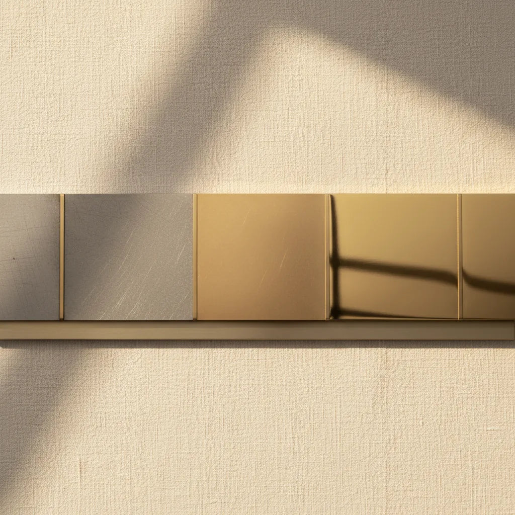 A progression strip: filed surface, emery-papered surface, tripoli finish, rouge mirror finish — left to right.